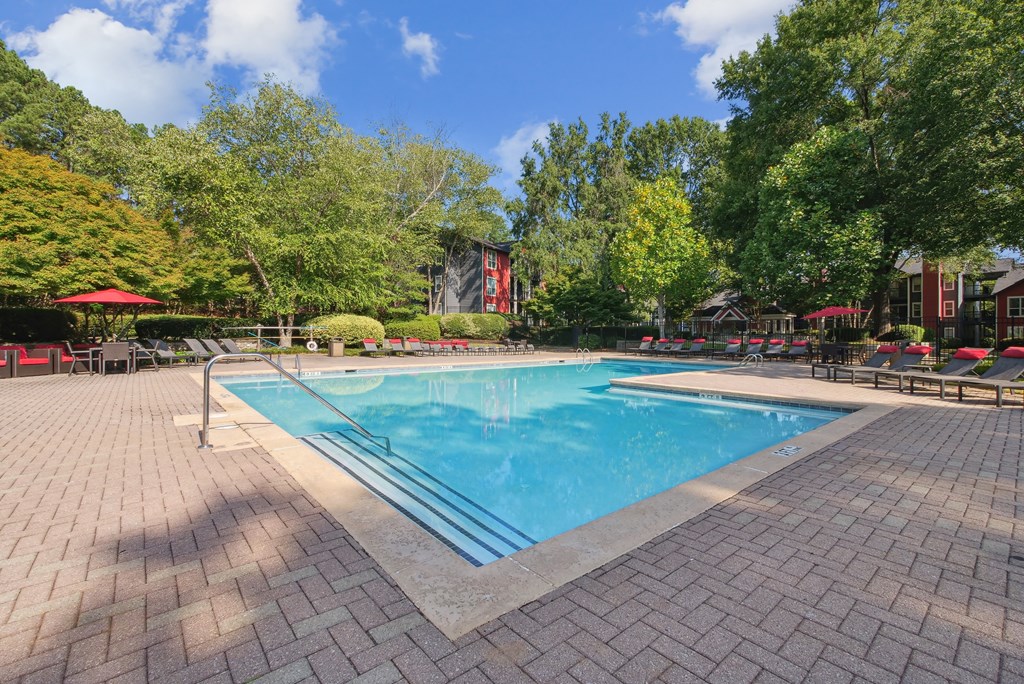 A rectangular pool surrounded by a brick patio at Elme Druid Hills, Atlanta, Georgia